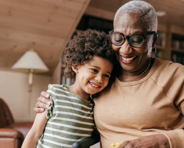 Image of an older woman hugging a child (not real patients) mobile