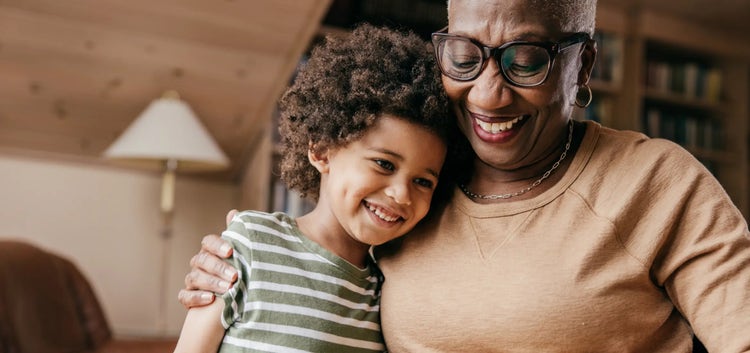 Image of an older woman hugging a child (not real patients)