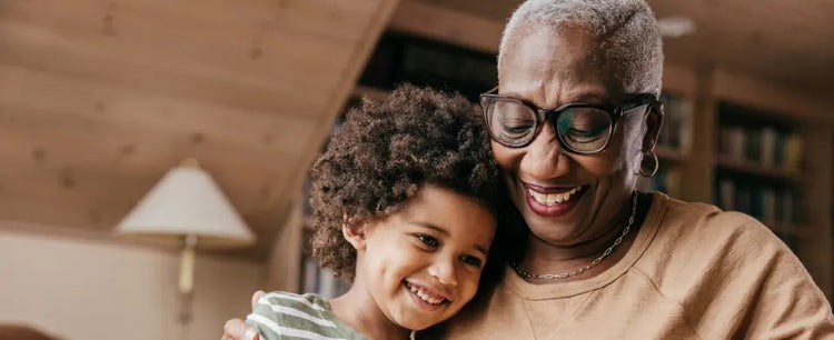 Image of an older woman hugging a child (not real patients)